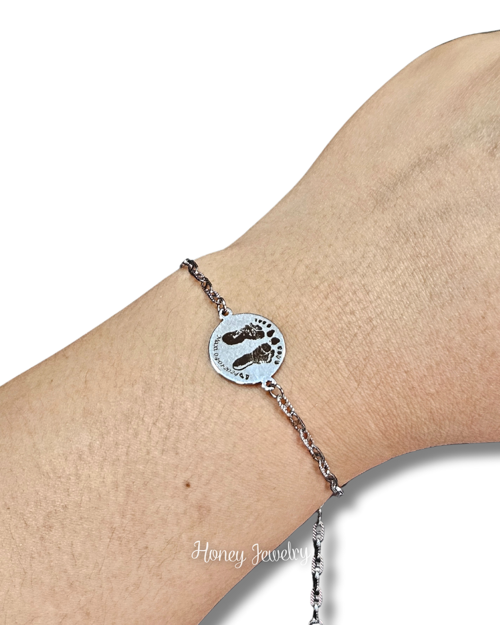 PULSERA PLACA REDONDA CON HUELLAS DE BEEB